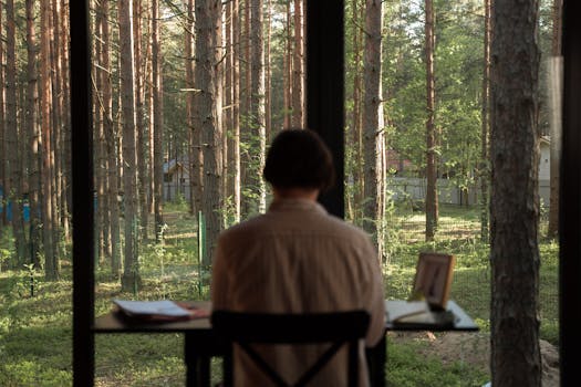 person meditating at their desk