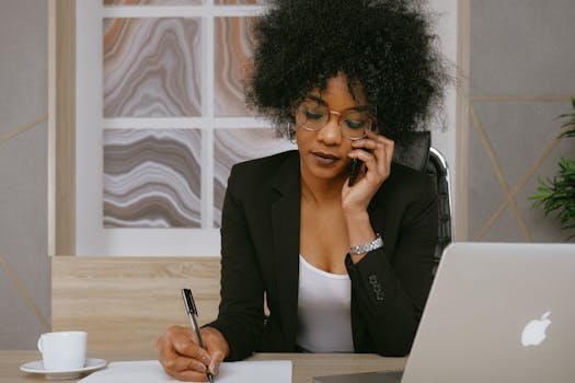 a busy professional reflecting at a desk