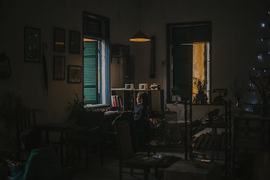 a cozy corner with plants and a comfortable chair