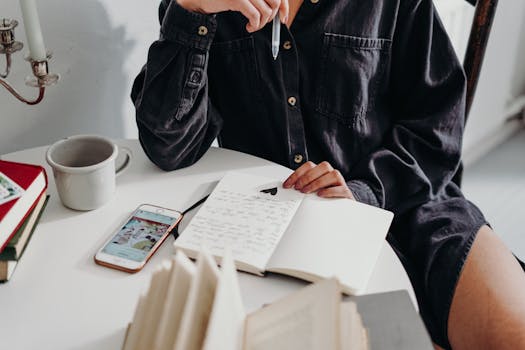 a person writing in a gratitude journal