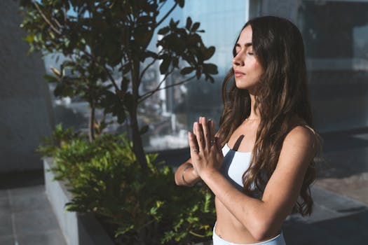 person meditating in nature