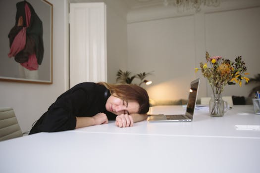 a person napping at their desk