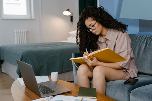 A person writing in a gratitude journal