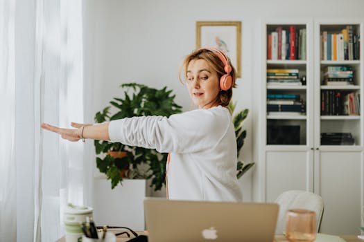 a person stretching at their desk