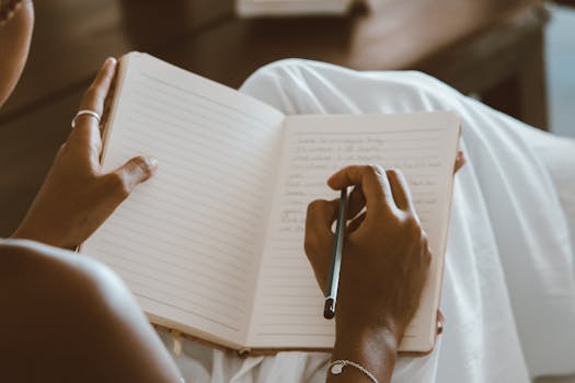 a person writing in a gratitude journal