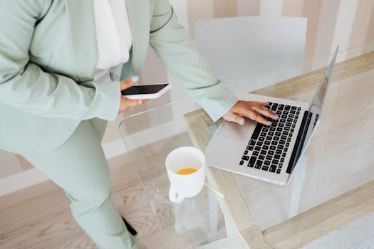 Person using a mindfulness app on their phone while at a desk